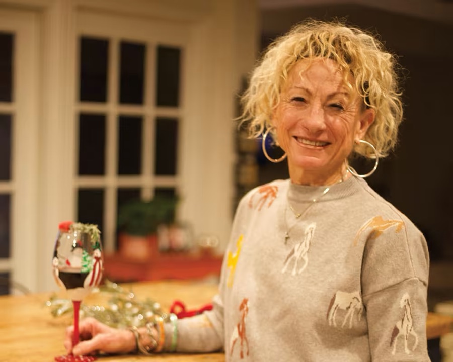 Kelley Green dressing up a glass of red wine, from Gin-gle All the Way